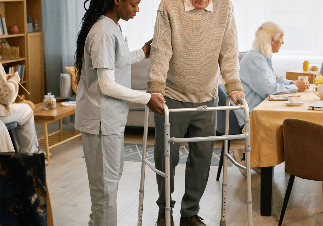 physiotherapist helping senior man with walker in edmonton at home